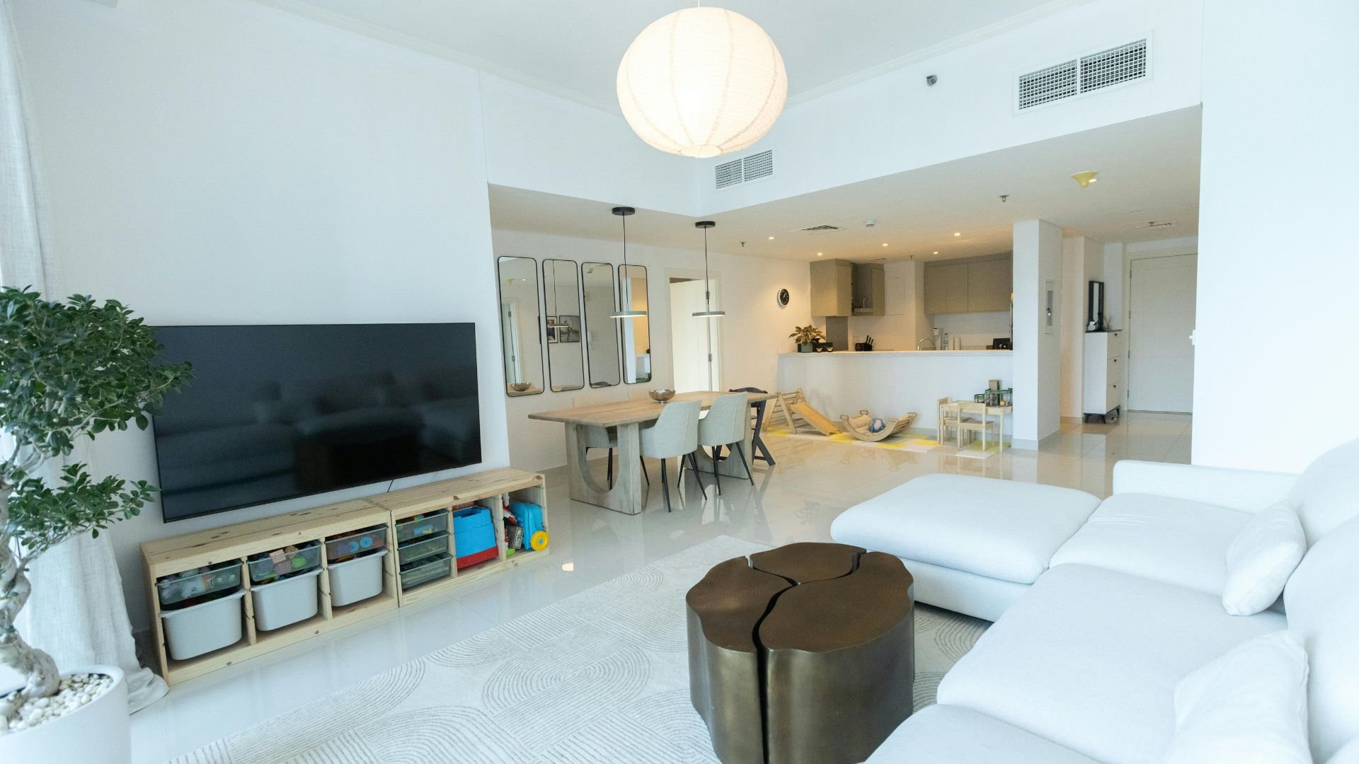 Modern, bright apartment with open living, dining, and kitchen areas